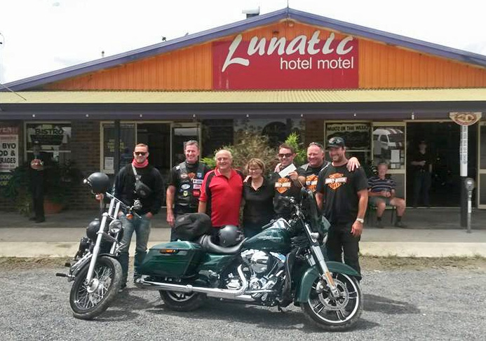 Bob and Desley (centre) presenting a cheque for $500 to the Hogs for Homeless motorcycle club