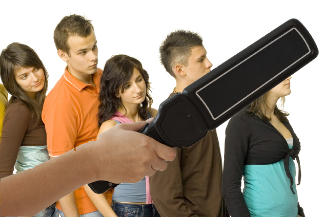 Isolated on white hand with black body scanner metal detector wi